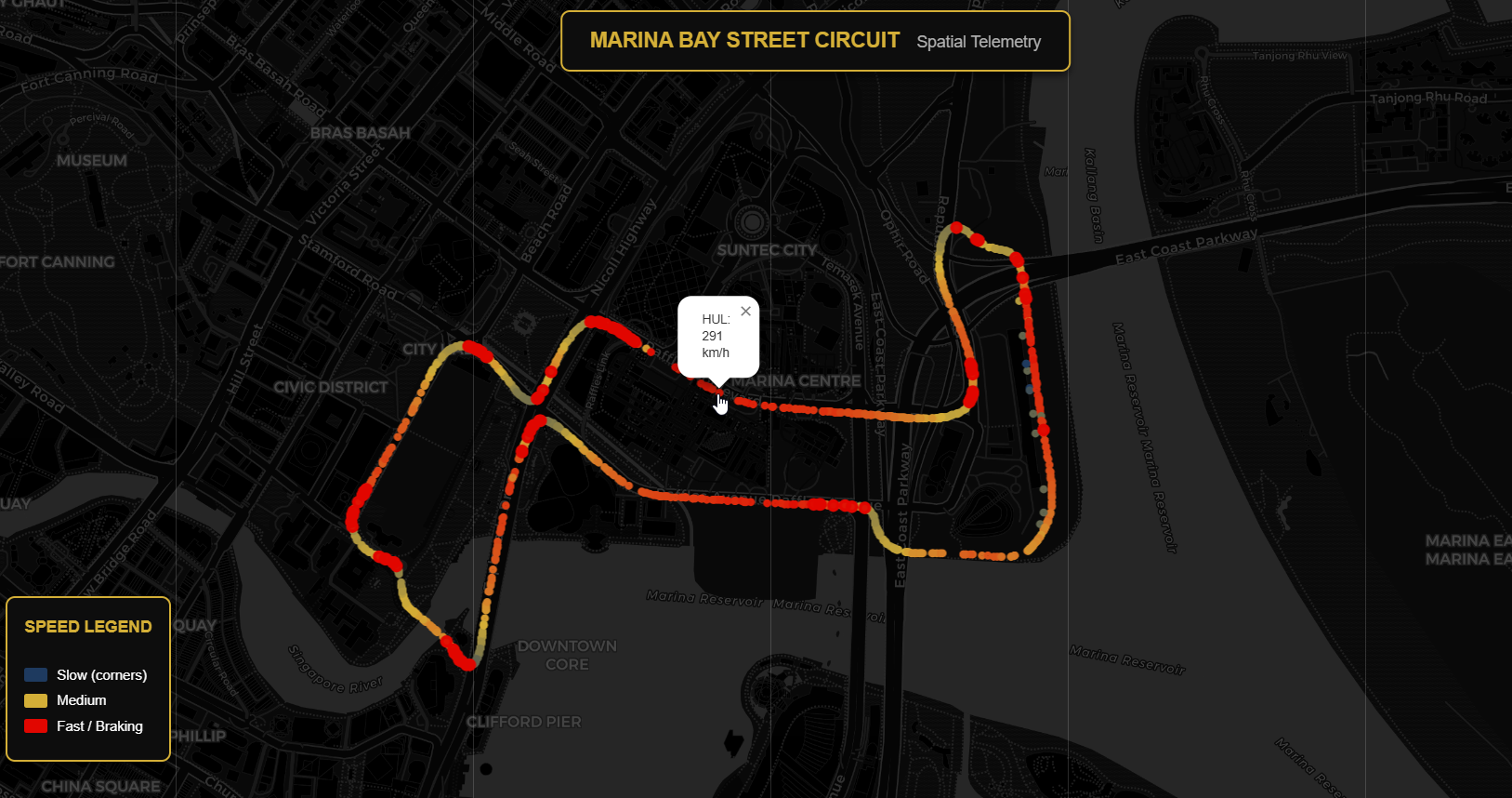 an interactive map showing car positions converted from telemetry x/y coordinates to geographic latitude/longitude. Points are colored by speed (blue=slow through corners, red=fast on straights), with braking zones highlighted. This visualization demonstrates Oracle's SDO_GEOMETRY capabilities storing real track positions that can be queried with spatial functions like SDO_WITHIN_DISTANCE.